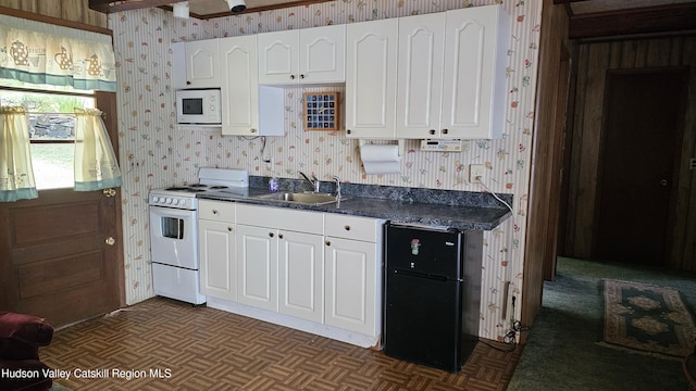 192 W Shore Dr, Valatie, NY 12184 - kitchen featuring white appliances, wallpapered walls, and white cabinetry
