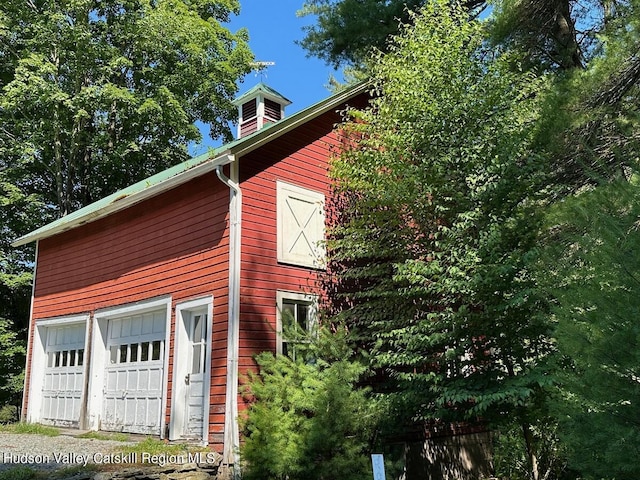 view of side of property with a garage