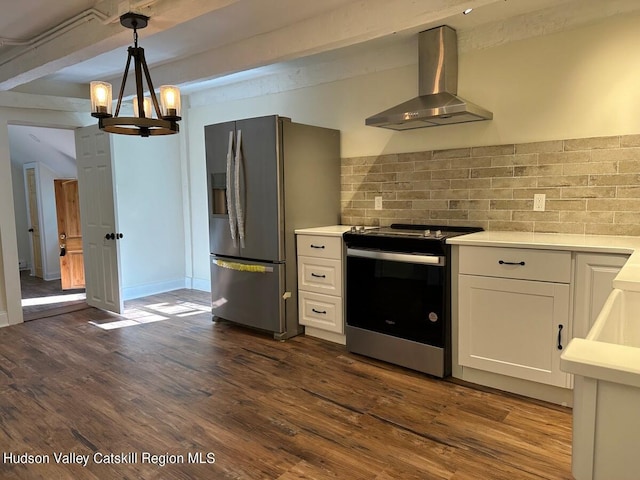 kitchen with white cabinetry, wall chimney exhaust hood, stainless steel appliances, dark hardwood / wood-style floors, and decorative light fixtures