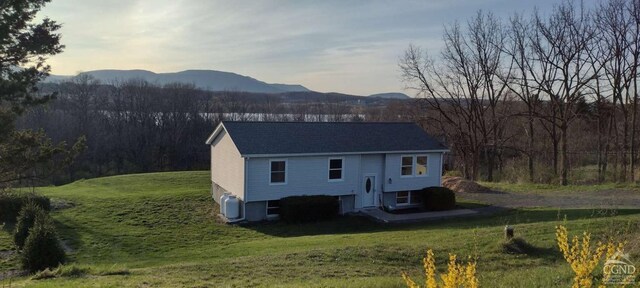 1316 Woods Rd, Germantown, NY 12526 - rear view of house with a mountain view and a lawn