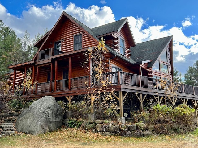 60 Leon Ln, Stony Creek, NY 12878 - rear view of property featuring log siding and roof with shingles