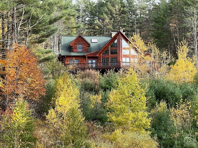 60 Leon Ln, Stony Creek, NY 12878 - back of house with log exterior and a wooded view
