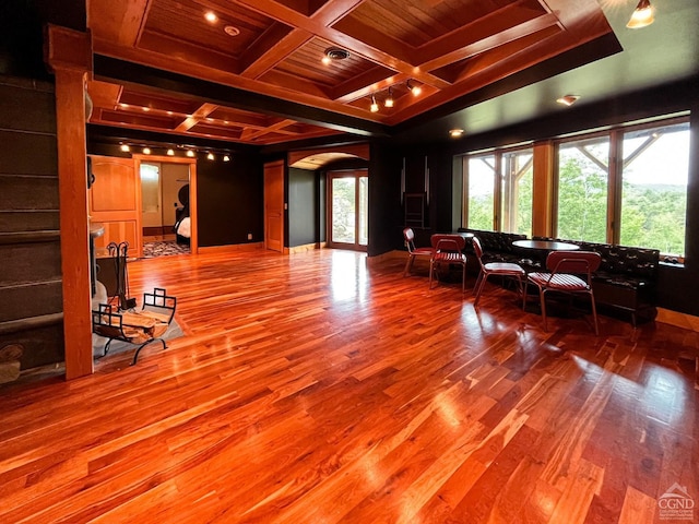 60 Leon Ln, Stony Creek, NY 12878 - living room with coffered ceiling, arched walkways, wood finished floors, a wooden ceiling with exposed beams, and crown molding