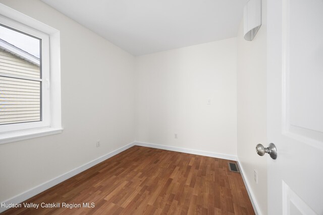 244 Columbia St, Hudson, NY 12534 - empty room featuring wood finished floors, plenty of natural light, and baseboards