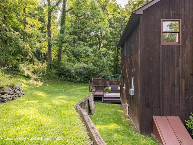 221 Cardinal Rd, Hyde Park, NY 12538 - view of grassy yard featuring a deck and a view of trees