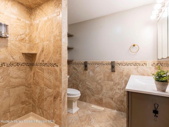 221 Cardinal Rd, Hyde Park, NY 12538 - bathroom with vanity, tile walls, wainscoting, and a tile shower