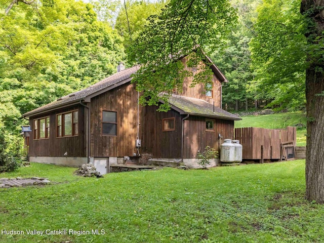 221 Cardinal Rd, Hyde Park, NY 12538 - view of side of home featuring a yard and a forest view