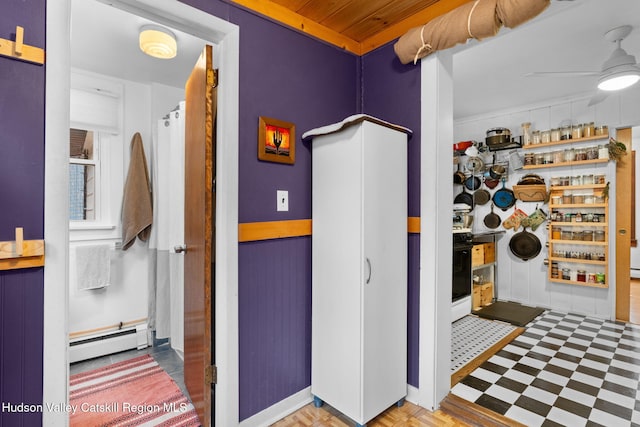 interior space featuring a baseboard radiator and ceiling fan