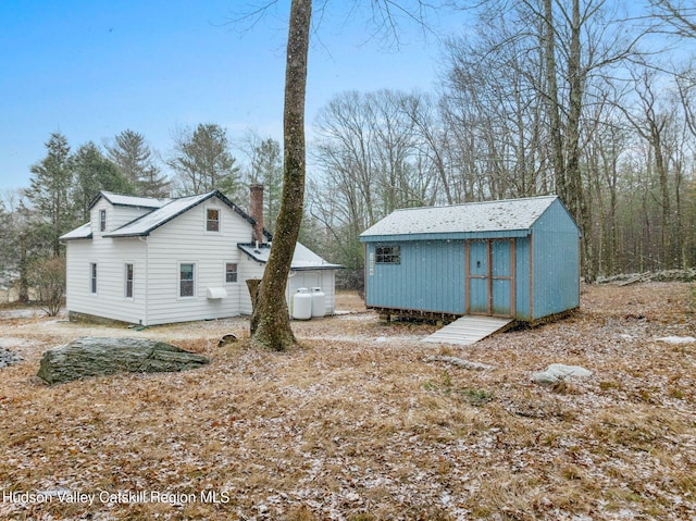 exterior space with a storage shed