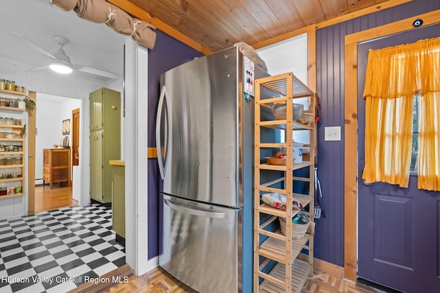 kitchen with stainless steel fridge, ceiling fan, wood ceiling, and parquet flooring