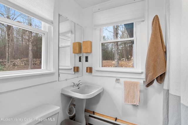 bathroom featuring toilet and sink