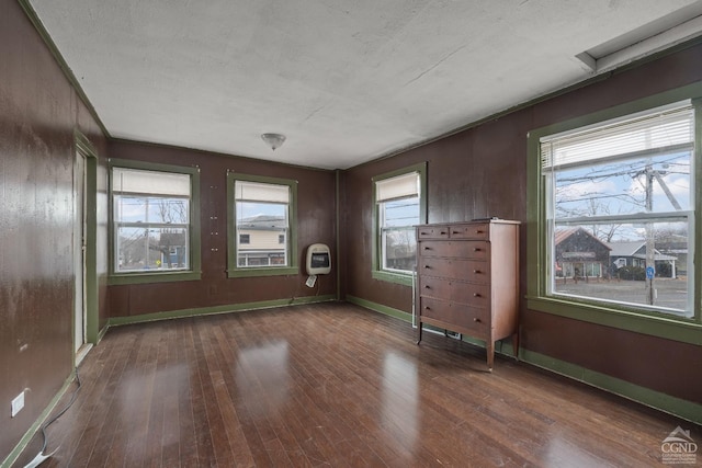 170 County Route 7a Unit 1, Copake, NY 12516 - empty room with hardwood / wood-style flooring, heating unit, and a textured ceiling