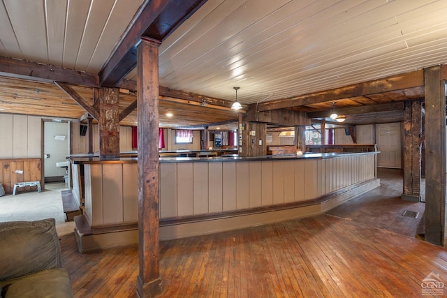 170 County Route 7a Unit 1, Copake, NY 12516 - kitchen featuring wood walls, wood-type flooring, healthy amount of natural light, wood ceiling, and dark countertops