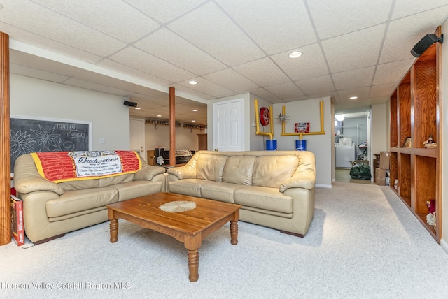 carpeted living room featuring washer / dryer, recessed lighting, baseboards, and a drop ceiling