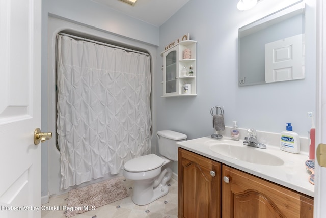 bathroom featuring toilet and vanity