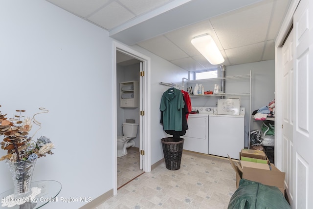 laundry room featuring laundry area, light floors, and washer and clothes dryer