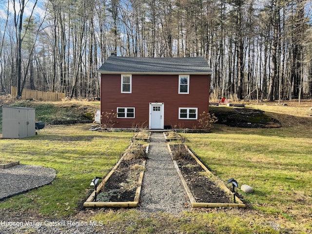 view of outdoor structure featuring a lawn