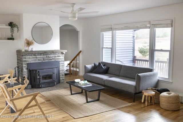 living area featuring a healthy amount of sunlight, ceiling fan, and light wood finished floors