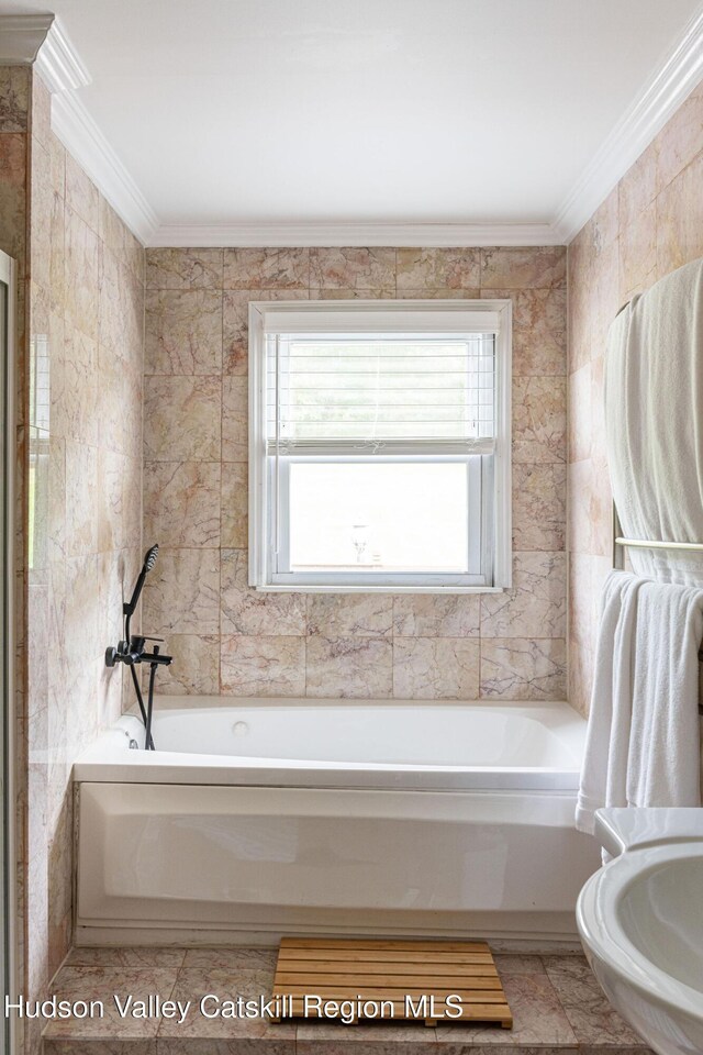 full bath with crown molding and a bath