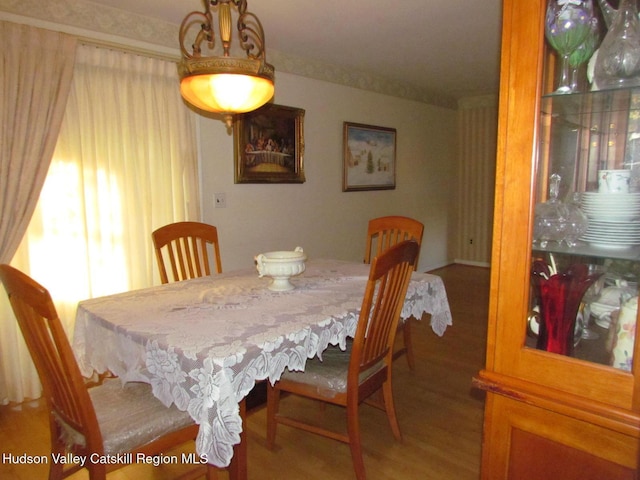 dining area with wood-type flooring