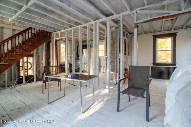 interior space with radiator heating unit and wood-type flooring