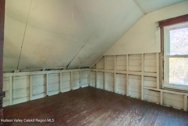 bonus room featuring hardwood / wood-style flooring and vaulted ceiling