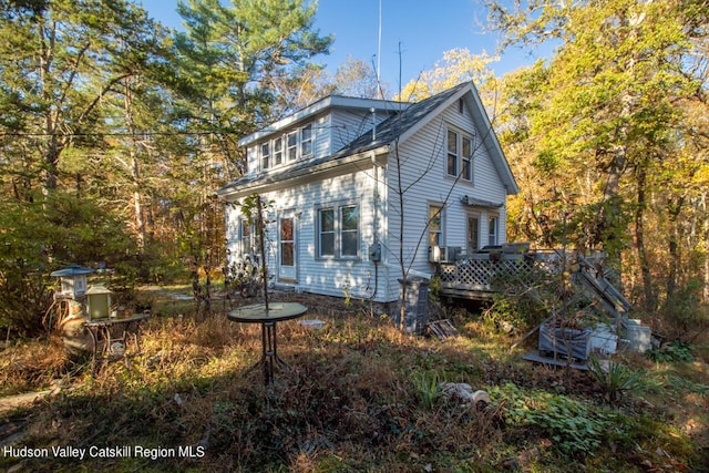 view of side of property featuring a deck