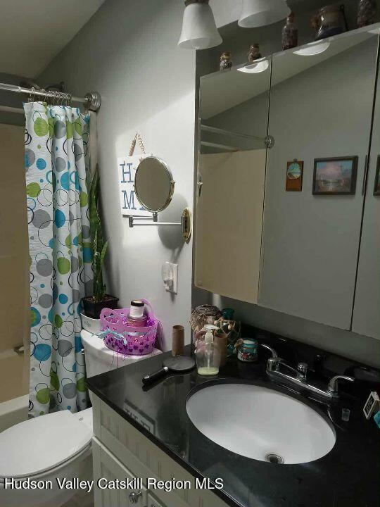 2 Plattekill Dr, Mount Marion, NY 12456 - bathroom with vanity, shower / bath combination with curtain, and toilet