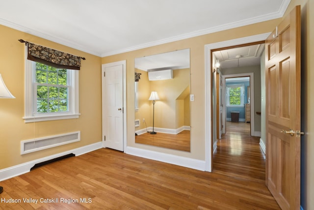 242 N Manor Ave, Kingston, NY 12401 - unfurnished bedroom featuring attic access, light wood finished floors, baseboards, and ornamental molding