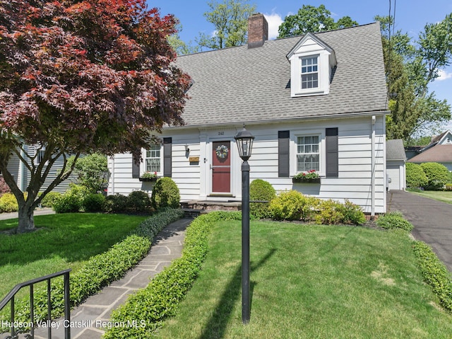 242 N Manor Ave, Kingston, NY 12401 - cape cod home featuring a front lawn, a chimney, and a shingled roof