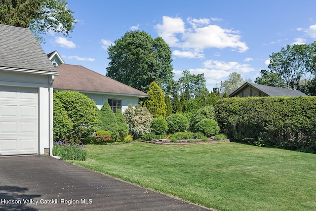 242 N Manor Ave, Kingston, NY 12401 - view of green lawn featuring a garage