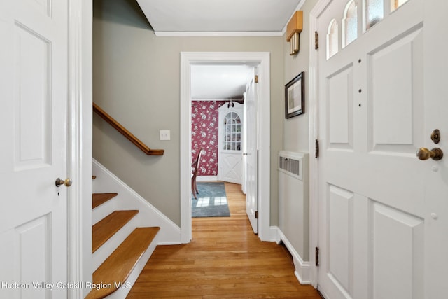 242 N Manor Ave, Kingston, NY 12401 - entrance foyer featuring light wood finished floors, baseboards, wallpapered walls, ornamental molding, and stairway