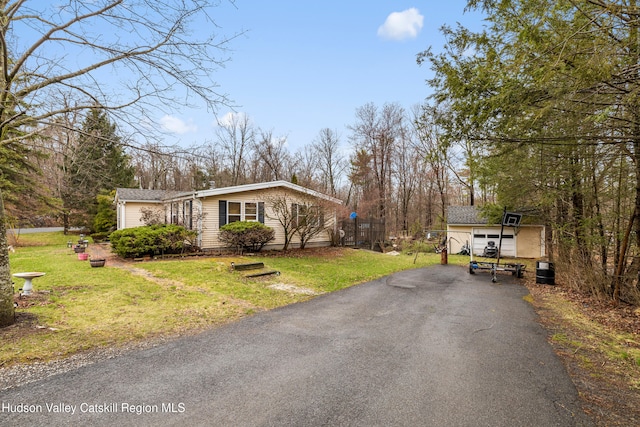 252 Ruby Rd, Kingston, NY 12401 - view of front of property with aphalt driveway, an outbuilding, and a front lawn