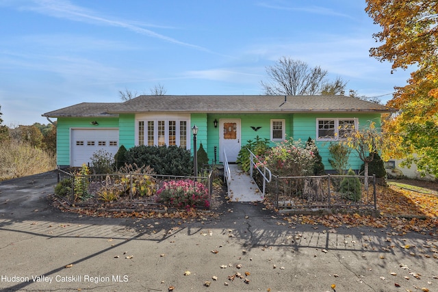 single story home with a garage