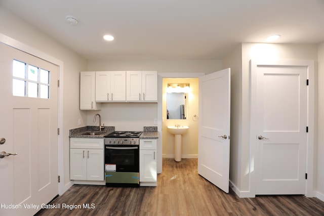 14311 Rte 9w, New Baltimore, NY 12124 - kitchen featuring a sink, stainless steel gas range oven, baseboards, and dark wood-style flooring