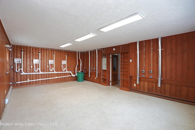 14311 Rte 9w, New Baltimore, NY 12124 - unfurnished room with wooden walls, a baseboard radiator, and electric panel