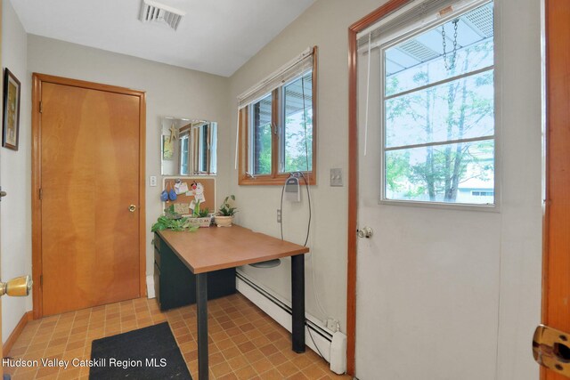 12 Roming Ln, Saugerties, NY 12477 - doorway to outside with baseboard heating, light floors, and baseboards