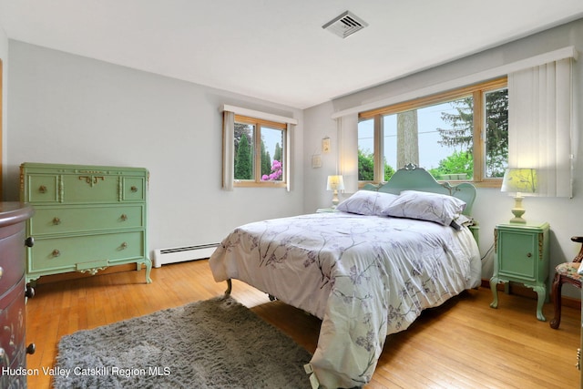 12 Roming Ln, Saugerties, NY 12477 - bedroom featuring baseboard heating and light wood-style flooring