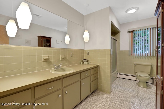 12 Roming Ln, Saugerties, NY 12477 - bathroom featuring a baseboard heating unit, vanity, tile walls, toilet, and tile patterned flooring