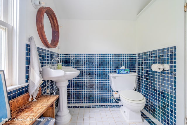 84 Old Rte 82, Hudson, NY 12534 - bathroom with tile patterned flooring, toilet, tile walls, and wainscoting