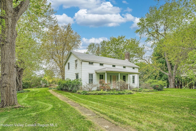 84 Old Rte 82, Hudson, NY 12534 - view of front of home featuring a chimney, a front yard, and covered porch