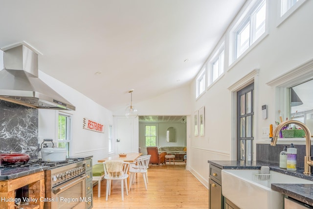 84 Old Rte 82, Hudson, NY 12534 - kitchen with a sink, gas stove, exhaust hood, light wood-type flooring, and tasteful backsplash