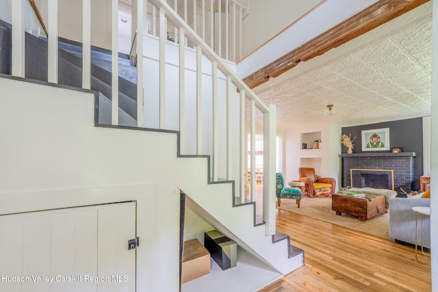 84 Old Rte 82, Hudson, NY 12534 - stairs with wood finished floors and a brick fireplace