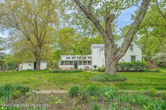 84 Old Rte 82, Hudson, NY 12534 - view of front facade featuring a sunroom and a front lawn