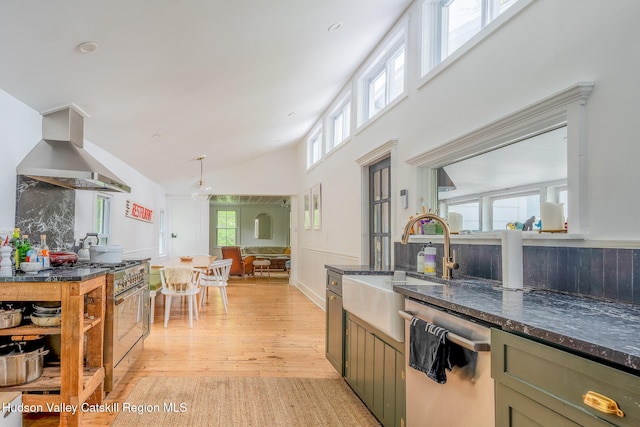 84 Old Rte 82, Hudson, NY 12534 - kitchen with stainless steel appliances, wall chimney range hood, light wood-style floors, dark stone countertops, and high vaulted ceiling