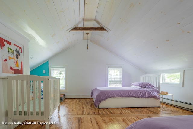 84 Old Rte 82, Hudson, NY 12534 - bedroom featuring a baseboard radiator, multiple windows, wood-type flooring, vaulted ceiling, and wooden ceiling