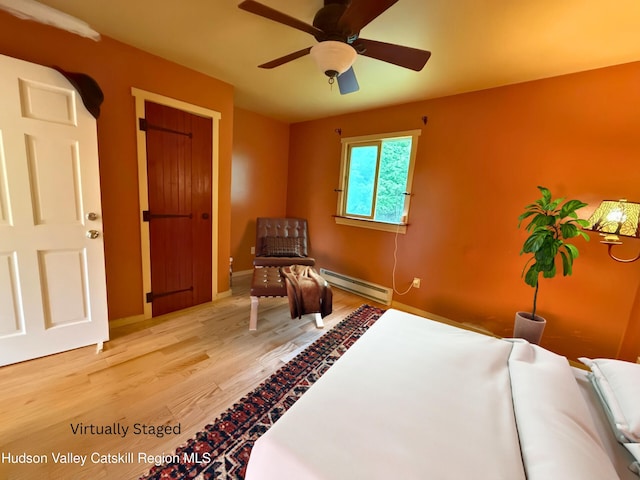65 Bluebird Ln, Andes, NY 13731 - bedroom featuring baseboard heating, light wood finished floors, baseboards, and a ceiling fan