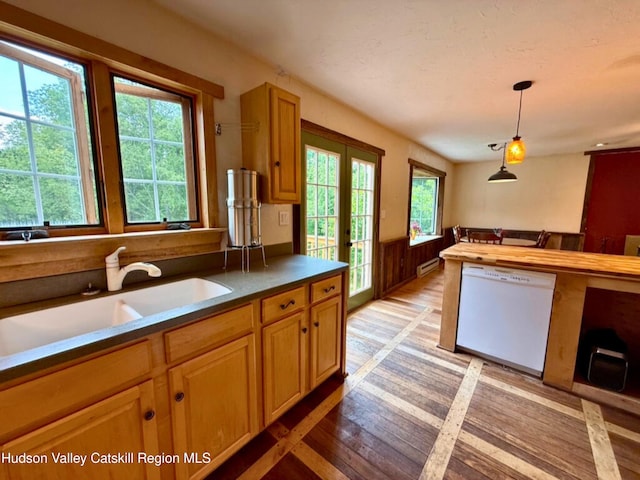 65 Bluebird Ln, Andes, NY 13731 - kitchen featuring white dishwasher, a sink, baseboard heating, light wood-style floors, and decorative light fixtures