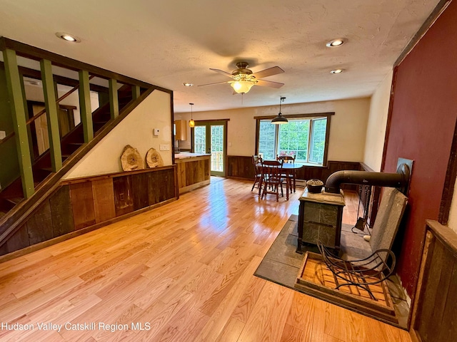 65 Bluebird Ln, Andes, NY 13731 - living room with wainscoting, wood finished floors, stairs, ceiling fan, and recessed lighting