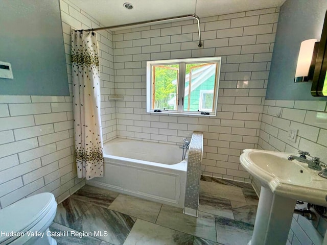 65 Bluebird Ln, Andes, NY 13731 - bathroom with tile walls, toilet, marble look tile flooring, and shower / bath combo with shower curtain